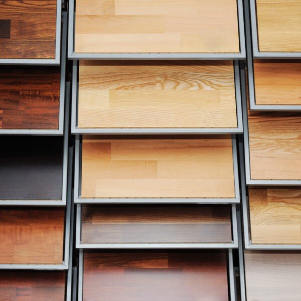 Solid teak flooring samples with natural wood grain